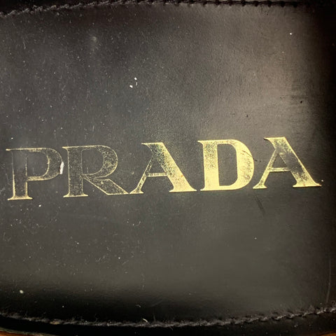 PRADA Taille 10 Chaussures à lacets en cuir perforé noir et blanc